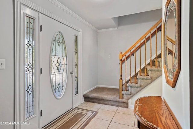 tiled foyer with ornamental molding