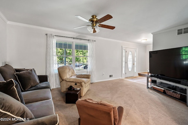 living room featuring carpet floors, ornamental molding, and ceiling fan