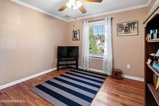 living area featuring ornamental molding, ceiling fan, and hardwood / wood-style floors