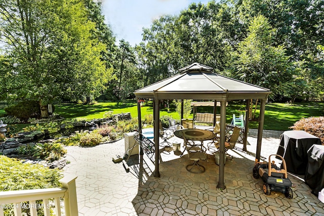 view of patio / terrace featuring a gazebo and a grill