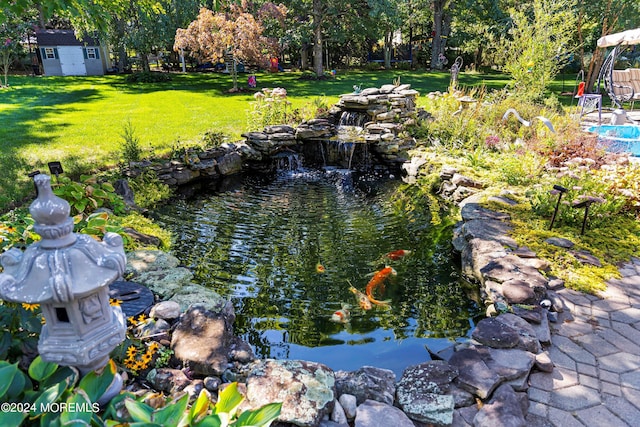 exterior details featuring a small pond