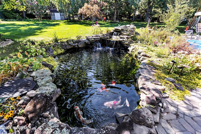 exterior details with a small pond