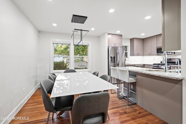 dining area with dark hardwood / wood-style flooring