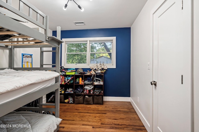 bedroom with hardwood / wood-style floors