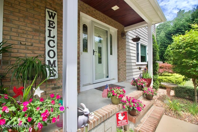 doorway to property with a porch