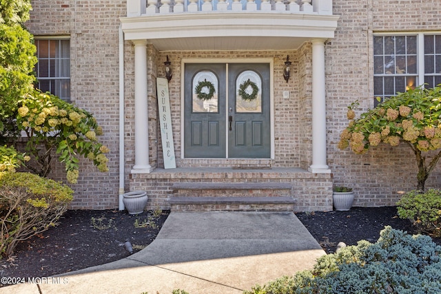 doorway to property featuring a balcony