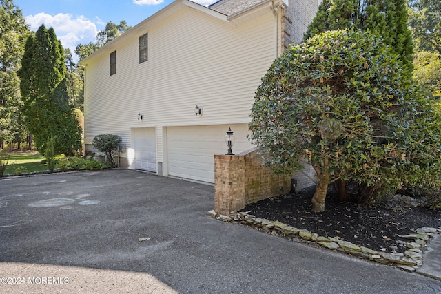 view of side of property featuring a garage