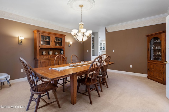 dining room with light colored carpet, a notable chandelier, and ornamental molding