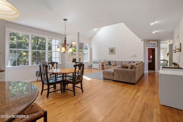 dining space with a chandelier and light hardwood / wood-style floors