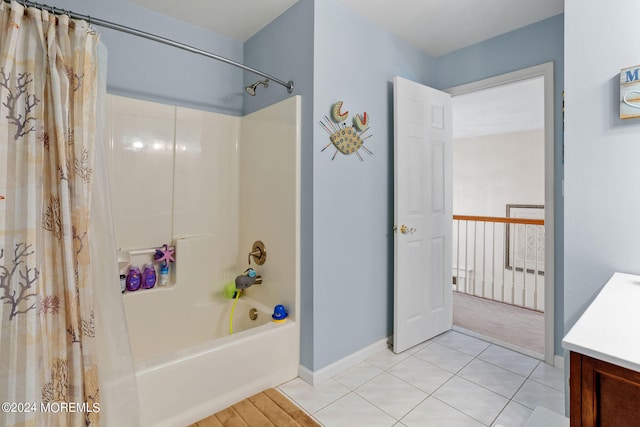 bathroom with tile patterned flooring, vanity, and shower / tub combo