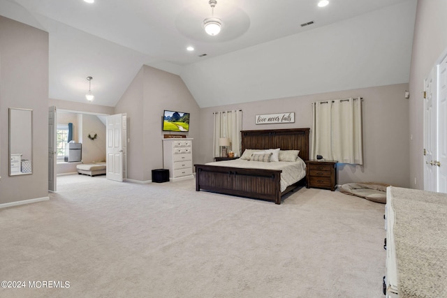 bedroom featuring light colored carpet and high vaulted ceiling