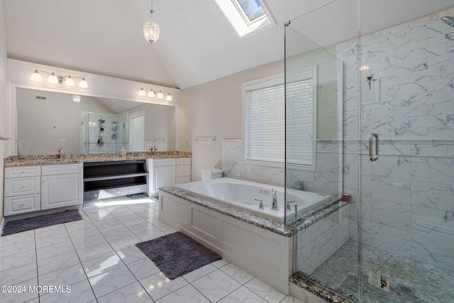 bathroom featuring lofted ceiling with skylight, vanity, and shower with separate bathtub