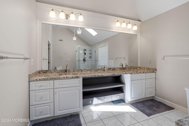 bathroom featuring vanity, vaulted ceiling, and a shower with door