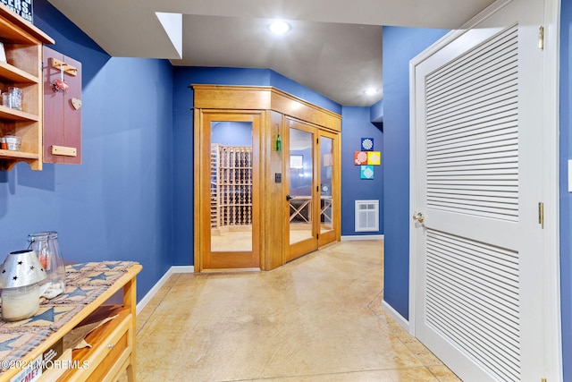 interior space with light carpet and french doors