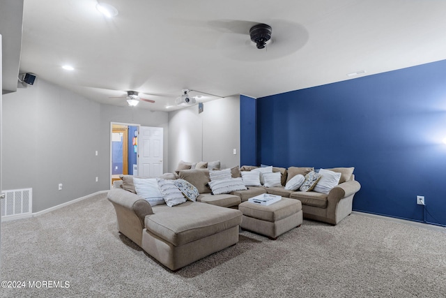 cinema with carpet floors and ceiling fan