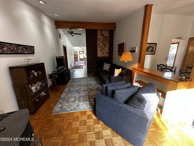 living room with ceiling fan and parquet floors