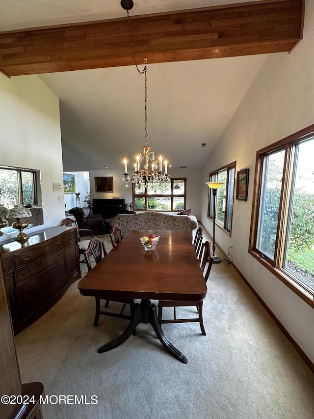 carpeted dining space featuring beam ceiling, a chandelier, and high vaulted ceiling