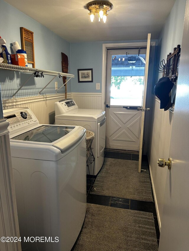 laundry area featuring separate washer and dryer and dark colored carpet