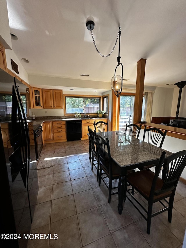 dining space with sink and tile patterned floors