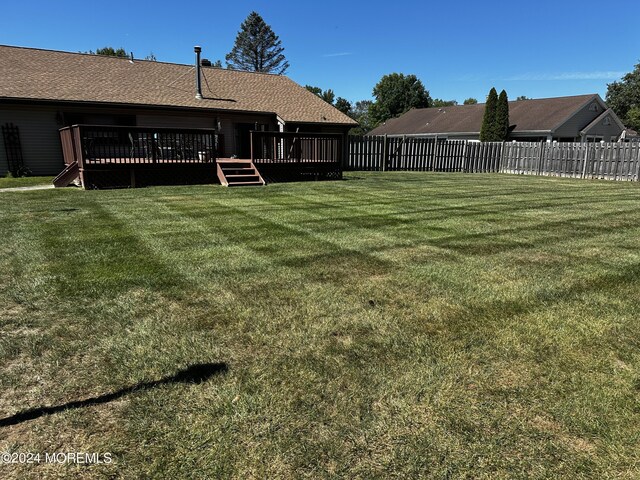 view of yard featuring a deck