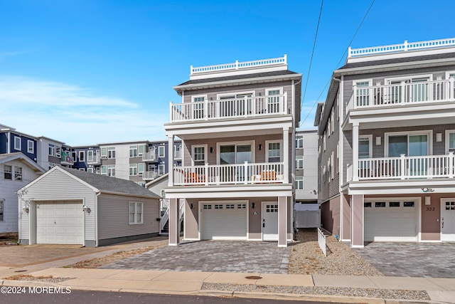 view of front of house with a balcony and a garage