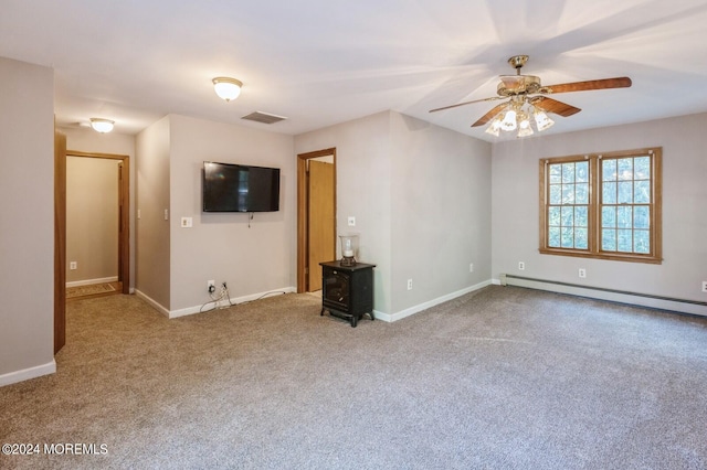 unfurnished living room featuring carpet floors, baseboard heating, and ceiling fan