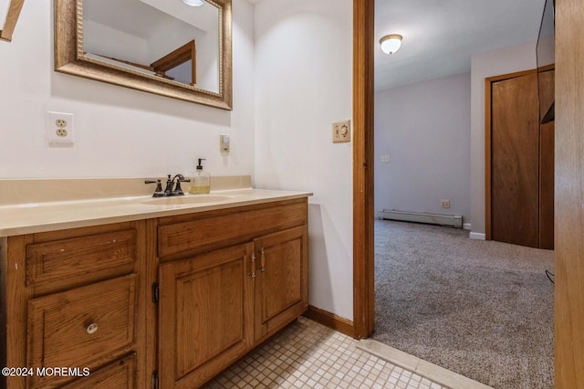 bathroom with vanity and a baseboard radiator