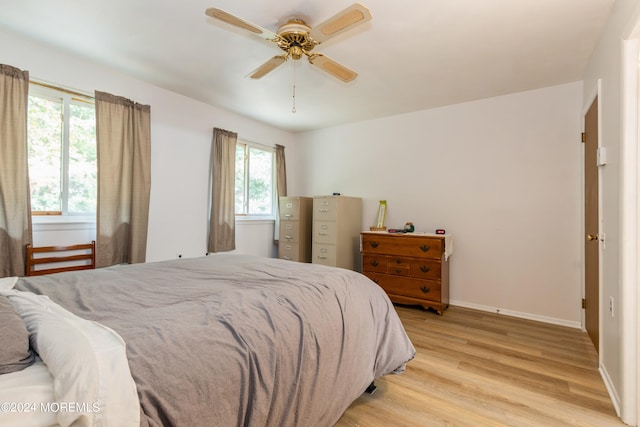 bedroom featuring light hardwood / wood-style floors and ceiling fan