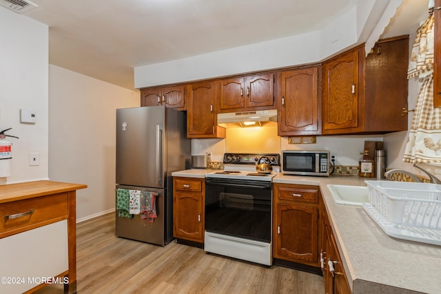 kitchen featuring light hardwood / wood-style floors and stainless steel appliances