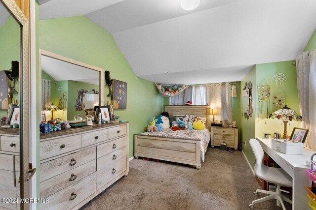 carpeted bedroom featuring vaulted ceiling