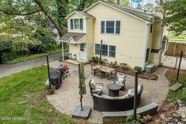 back of property featuring a patio