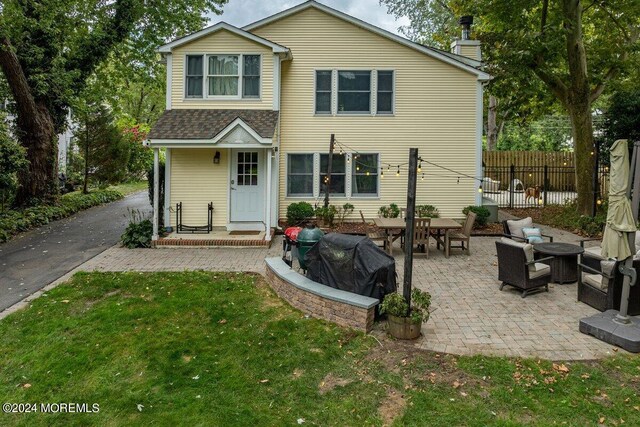 exterior space with a patio, a yard, and an outdoor hangout area