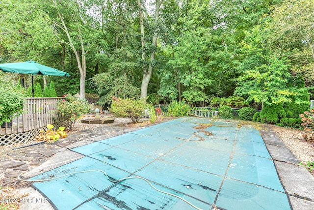 view of pool with a wooden deck