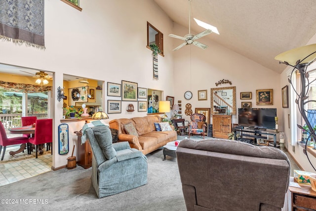 living room featuring high vaulted ceiling, carpet, and ceiling fan