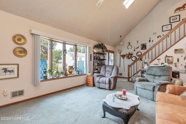 living room featuring a textured ceiling, carpet flooring, and high vaulted ceiling