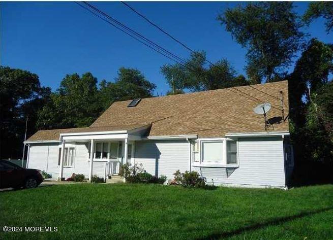 view of front of house with a front lawn and a porch