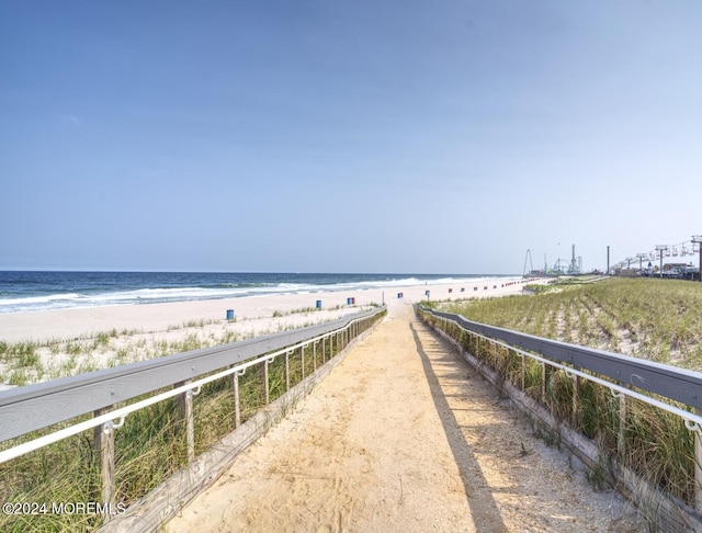 property view of water featuring a beach view