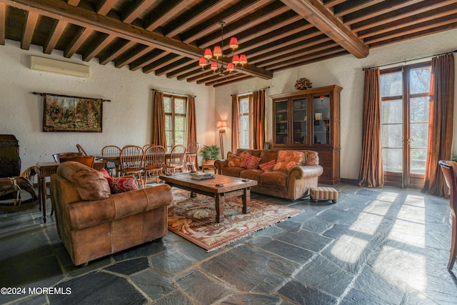 living room featuring an inviting chandelier, beamed ceiling, a wall mounted air conditioner, and french doors