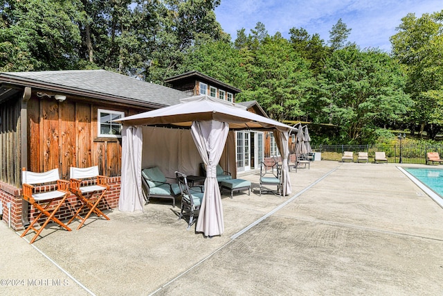 view of patio / terrace with a fenced in pool