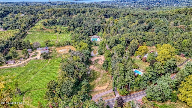 birds eye view of property with a rural view