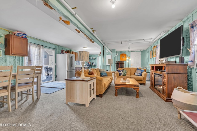 318 Bayview Ave, Union Beach, NJ 07735 - living room featuring light carpet and a glass covered fireplace