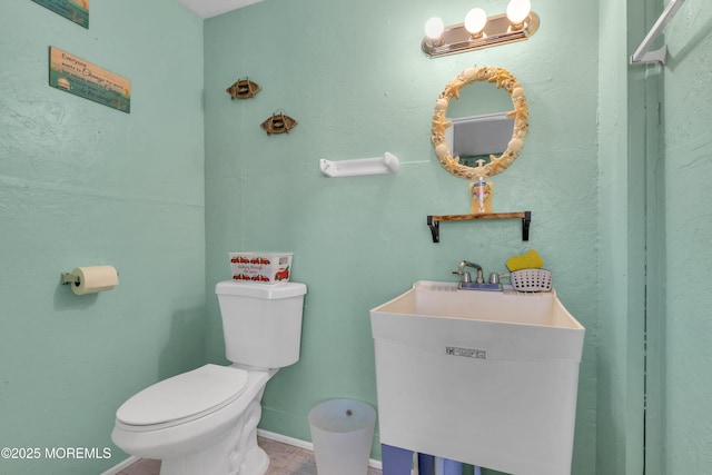 318 Bayview Ave, Union Beach, NJ 07735 - bathroom featuring a sink, toilet, and baseboards