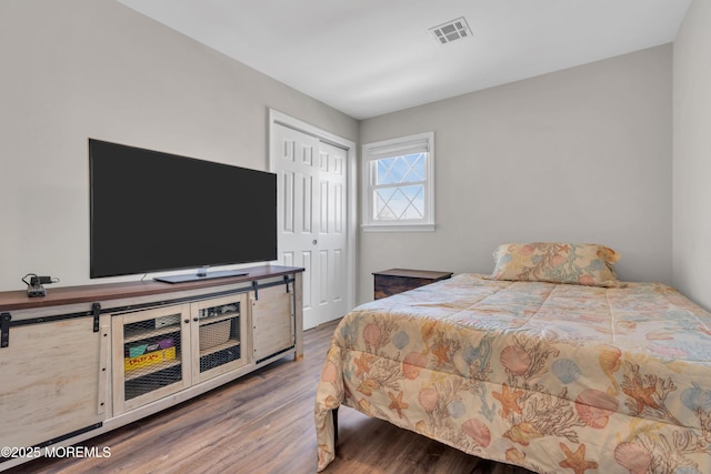 318 Bayview Ave, Union Beach, NJ 07735 - bedroom with a closet, wood finished floors, and visible vents