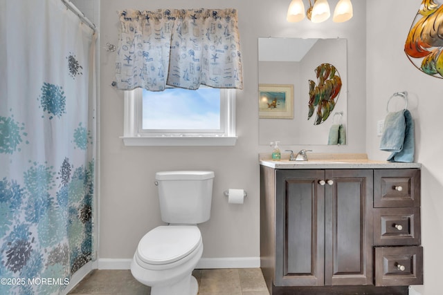 318 Bayview Ave, Union Beach, NJ 07735 - bathroom featuring baseboards, vanity, toilet, and tile patterned floors