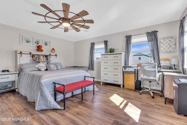 318 Bayview Ave, Union Beach, NJ 07735 - bedroom with visible vents, wood finished floors, a ceiling fan, and baseboards