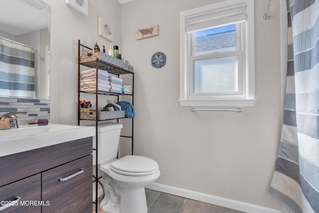 318 Bayview Ave, Union Beach, NJ 07735 - full bath featuring backsplash, toilet, vanity, tile patterned flooring, and baseboards