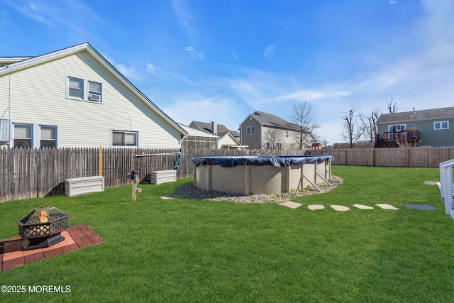 318 Bayview Ave, Union Beach, NJ 07735 - view of yard featuring a fenced backyard, a fire pit, and a fenced in pool