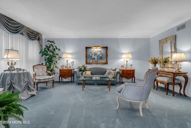 carpeted living room featuring ornamental molding