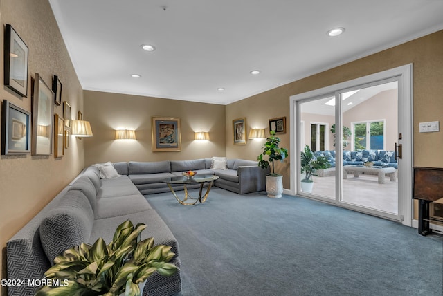 living room with ornamental molding, vaulted ceiling, and carpet flooring