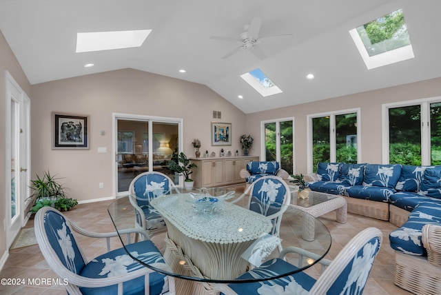 interior space featuring lofted ceiling with skylight and ceiling fan